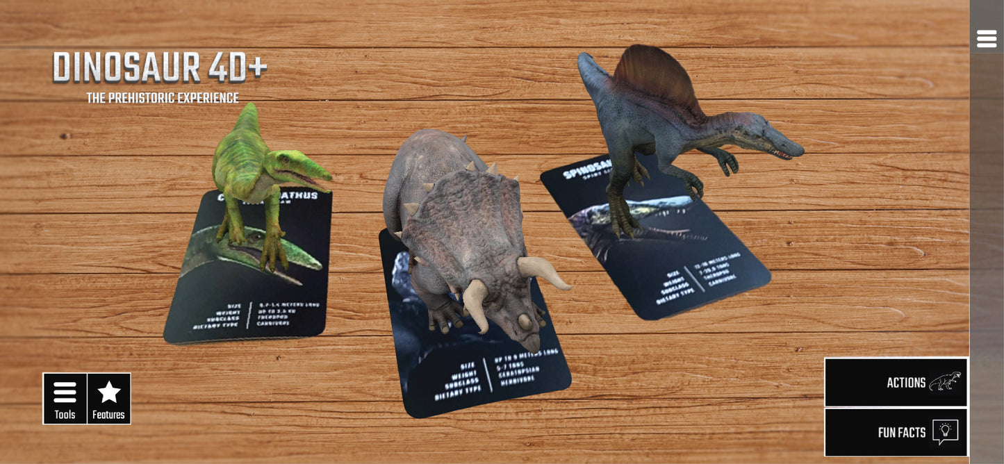 Three dinosaur figurines on cards with 'Dinosaur 4D+' branding on a wooden surface.